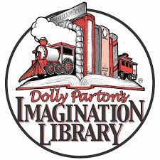 A row of books with train bookends holding them up on an open book. Caption reads Dolly Parton's Imagination Library