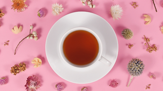 cup of tea on pink background