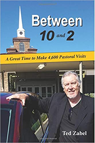 Ted Zabel posed in front of church with hand on top of a car. Book title is "Between 10 and 2: A Great Time to Make 4,600 Pastoral Visits" by Ted Zabel.